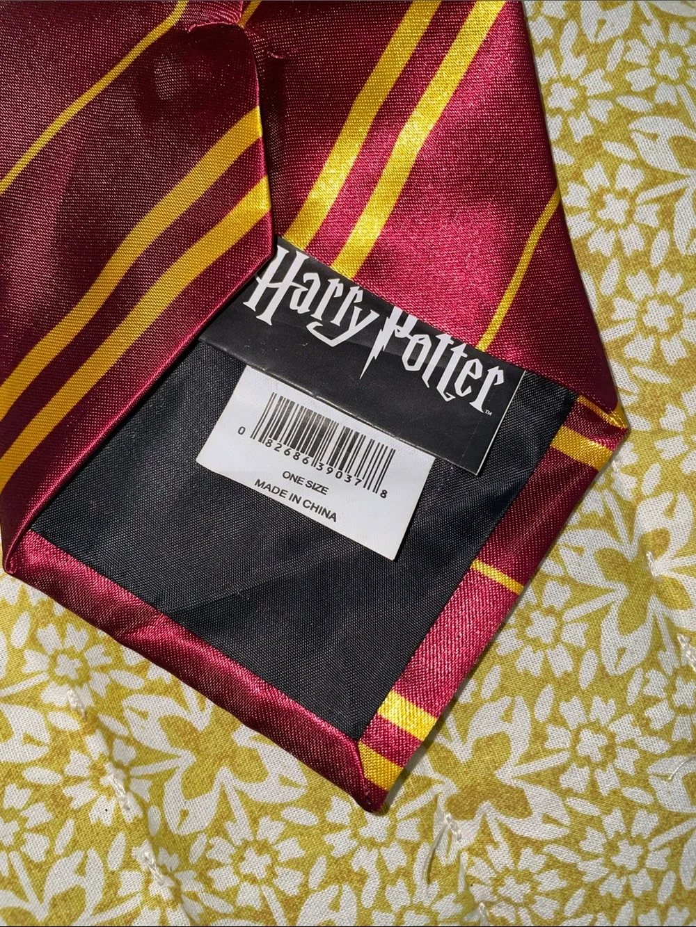 Burgundy and Gold Gryffindor Harry Potter tie.